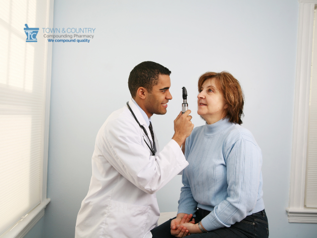 Doctor Conducting Ophthalmology Exam on Woman in Need of Low-Dose Atropine Eye Drops for Floaters